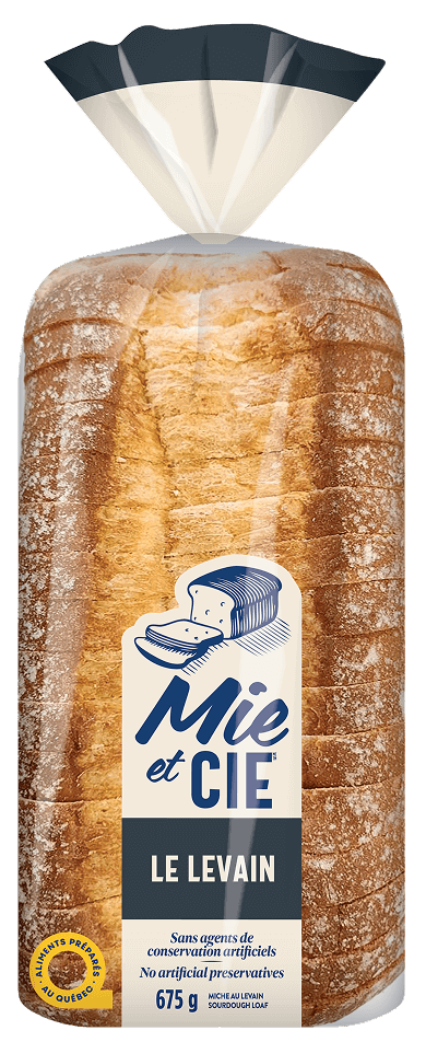 Pain au Levain saupoudrée de farine, pain tranché, sans agents de conservation artificiels. | Sourdough loaf with a light flour topping, sliced bread, no artificial preservatives.